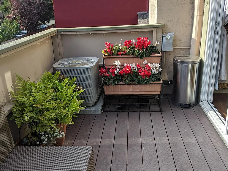 Large balcony houses A/C unit