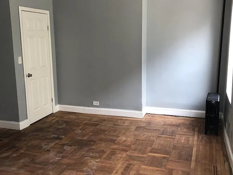 Bedroom with ceiling fan and closet