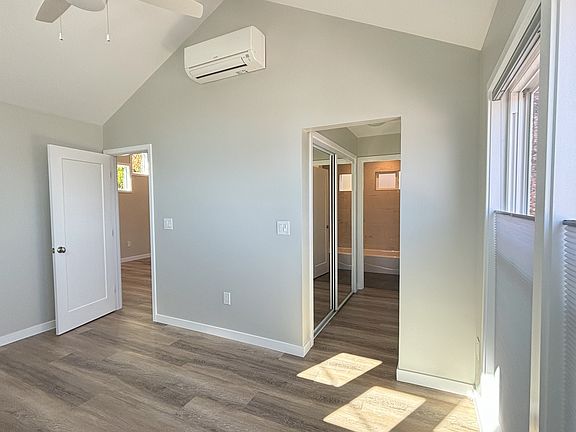 View in bedroom toward hall of mirrored closets.