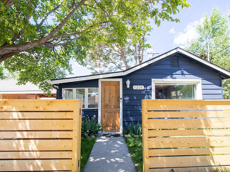 Fun blue cottage with new wooden doors