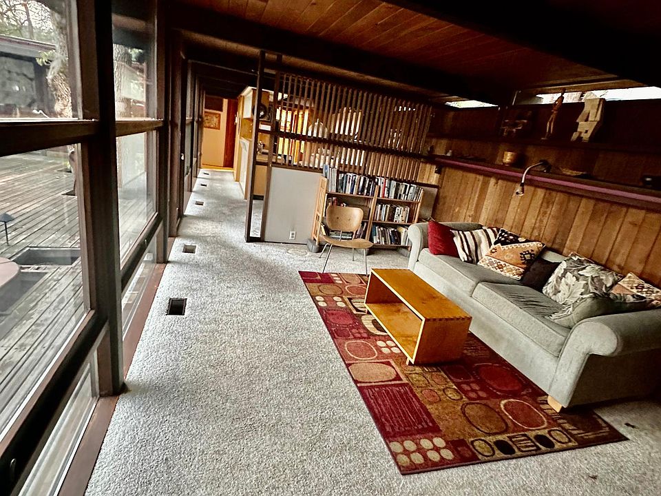 This is a view of the living room into the kitchen and the long hallway into the back of the house.