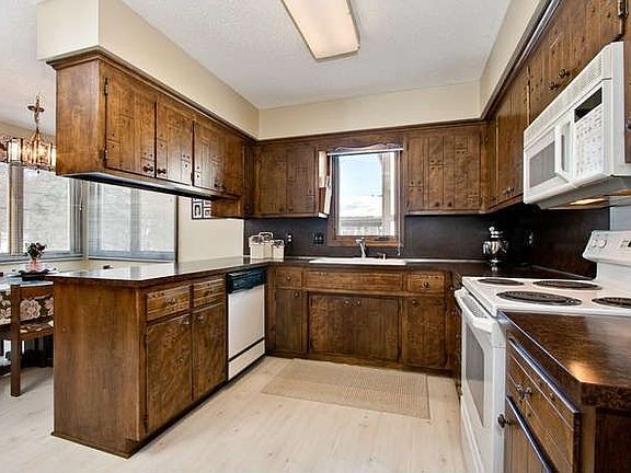 Eat-in Kitchen has tons of cabinetry and plenty of space for cooking.