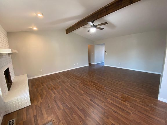 Large living area with vaulted ceiling & gas assist fireplace