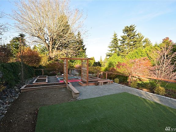 Raised garden beds. Astroturf in the foreground was used for kid's play structure.