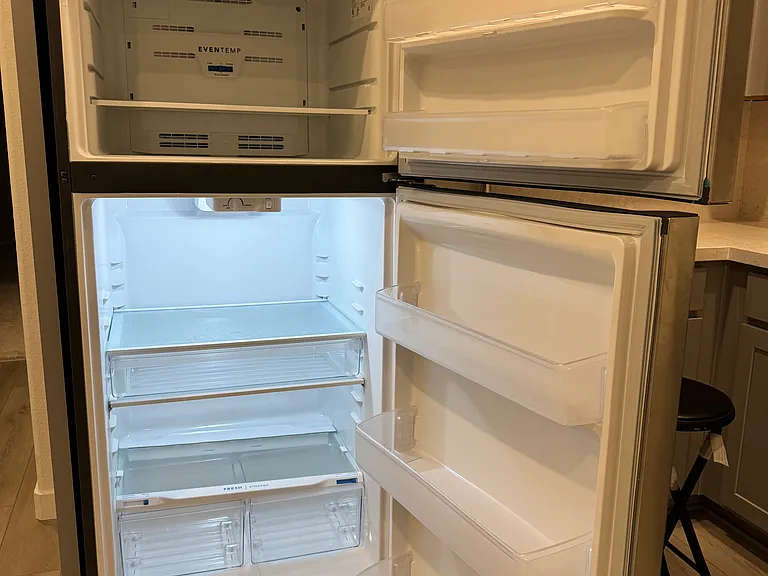 Top freezer compartment and bottom refrigerator compartment.