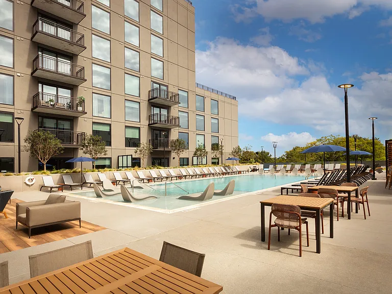 Swimming Pool with Seating | Select Apartments Overlooking the Pool Deck