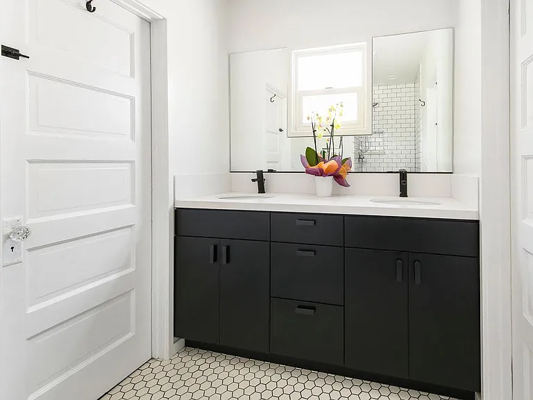 middle washroom with doors on either side