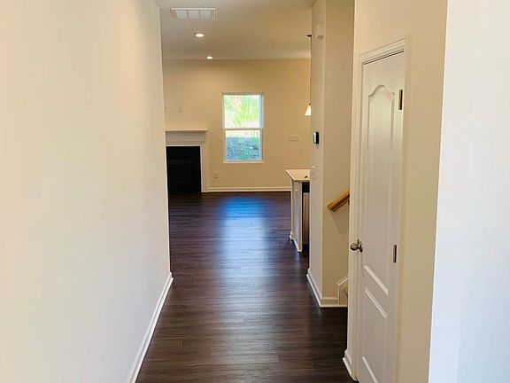 Separate dining room to the right, stairs to the 2nd level