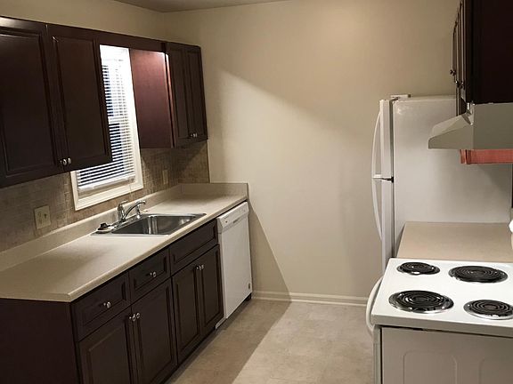 Kitchen with new cabinets, new counter tops and new ceramic back splash.