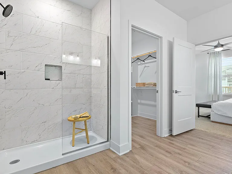Experience contemporary living with this stylish bathroom and inviting bedroom.