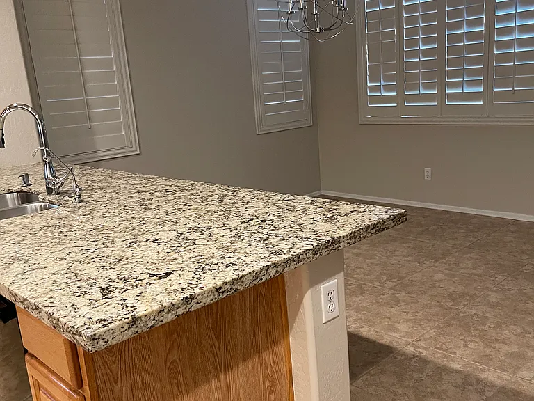 Kitchen peninsula adjoining dining room.