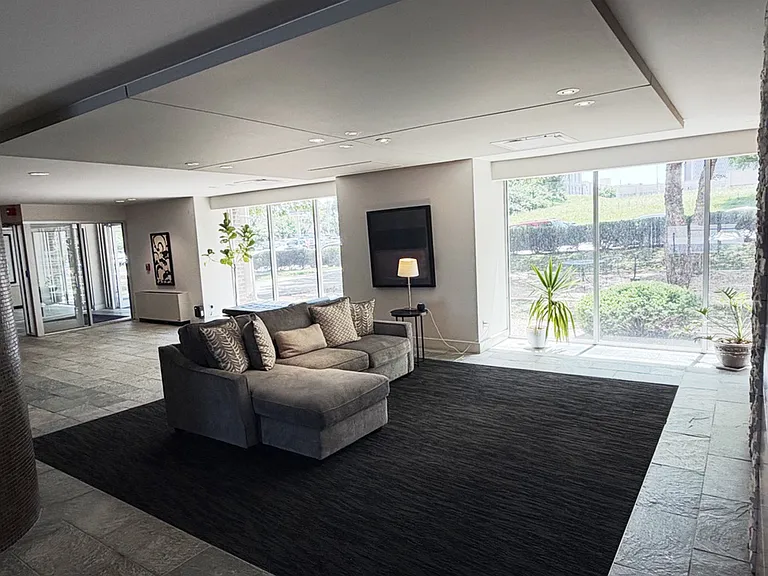 Elegant fireplace lounge with floor-to-ceiling windows_an upscale retreat right in your building