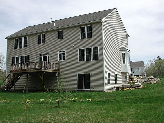Rear view of home from meadow