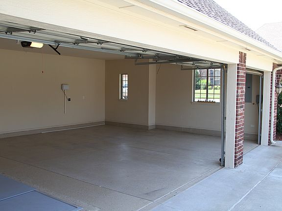 Three Car Garage with 6 Person Storm Shelter
