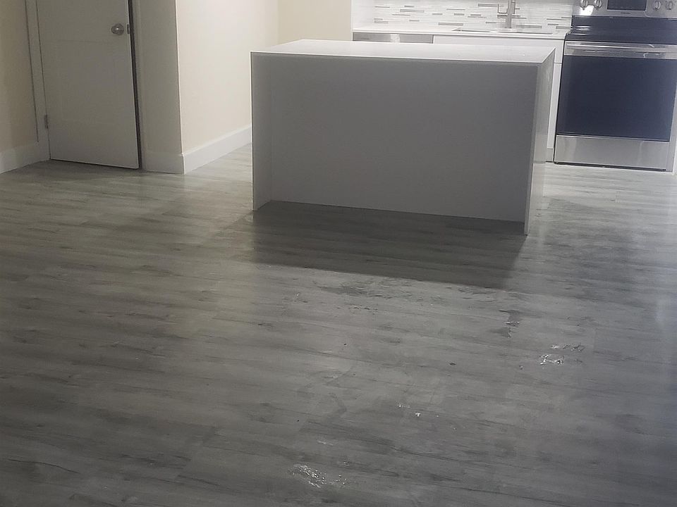 WHITE QAURTZ KITCHEN WITH WATERFALL ISLAND