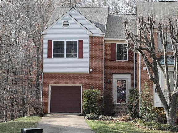 Front View of 6728 Sunset Woods Court. Woods and creek in the back.