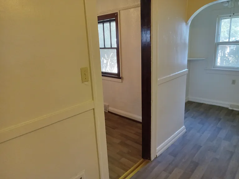 Kitchen view into dining room left and nook to the right