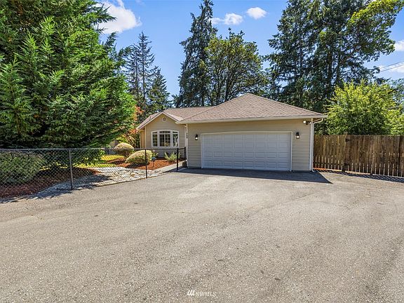 Long and wide driveway. Oversized double car garage with RV parking on the side>