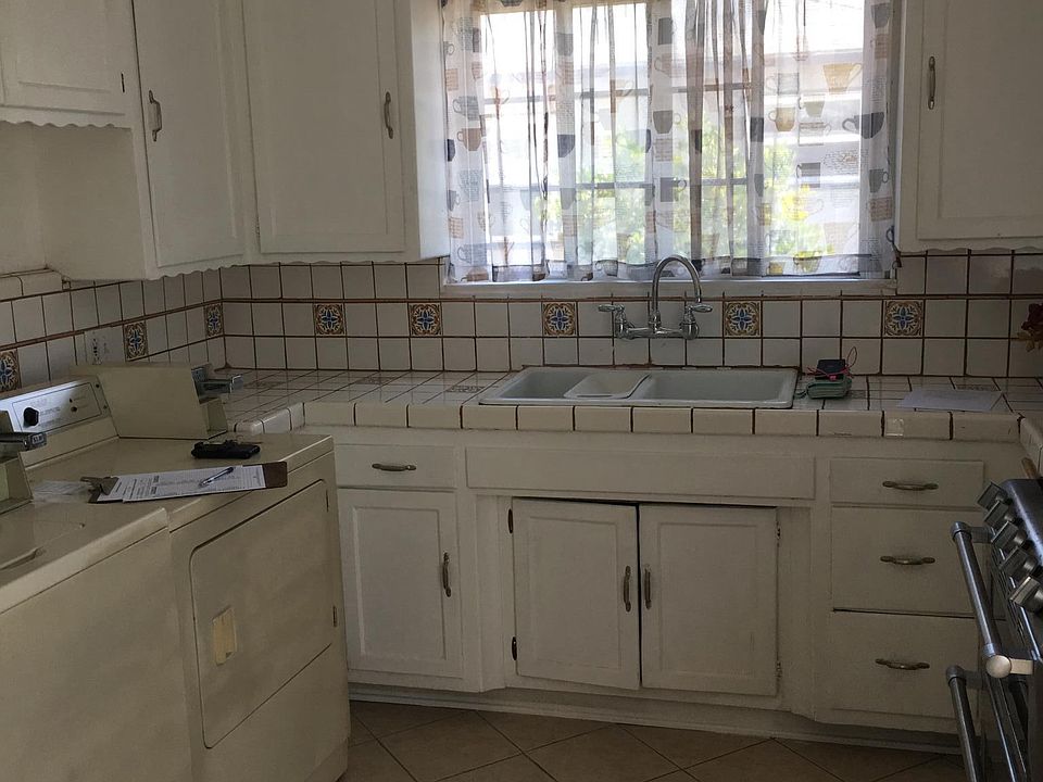 Kitchen with in-unit washer and dryer