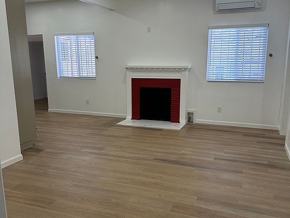 Living Room with gas fireplace and Split AC system