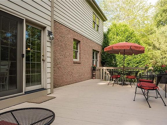 Full length deck well maintained and cedar siding on 2nd floor.