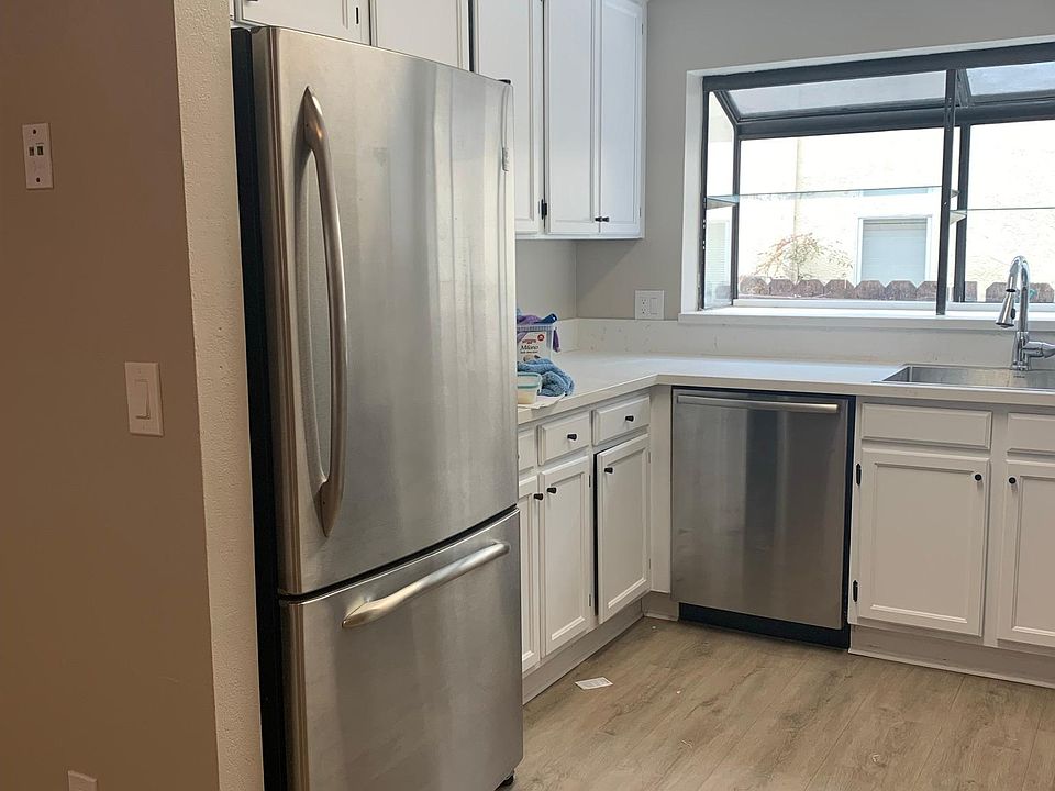 Kitchen features GE Profile french door fridge, whisper quiet Bosch dishwasher, and a deep single basin sink.