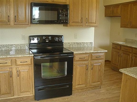 Kitchen with new granite and hardwood floors