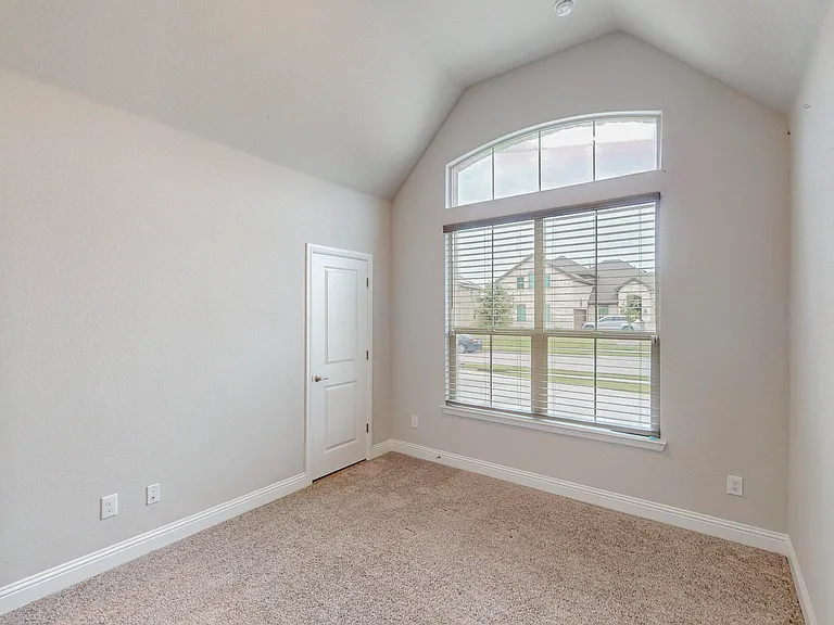 This 3rd bedroom will be a favorite due to it's vaulted ceiling and abundant natural lighting!