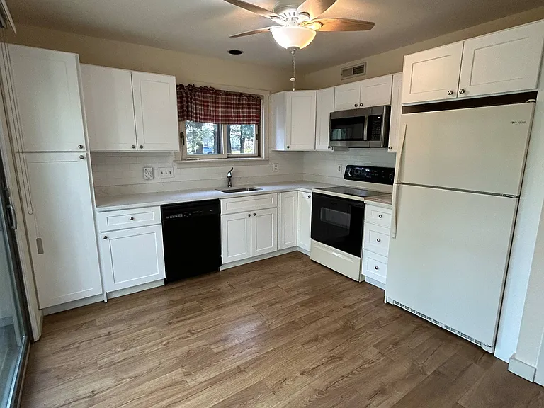 New Kitchen Cabinets. Kitchen has access to Patio.