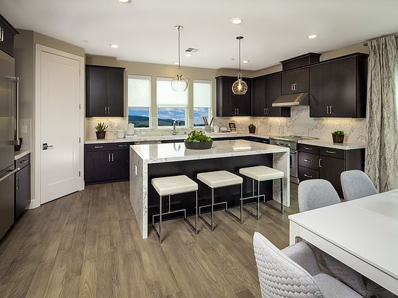 This modern kitchen is a sleek and functional culinary space that combines cutting-edge design with