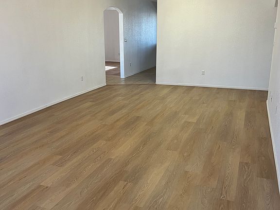 Living room of three bedroom side of home with luxury flooring