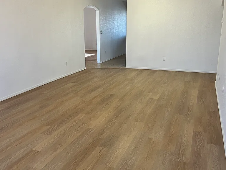 Living room of three bedroom side of home with luxury flooring