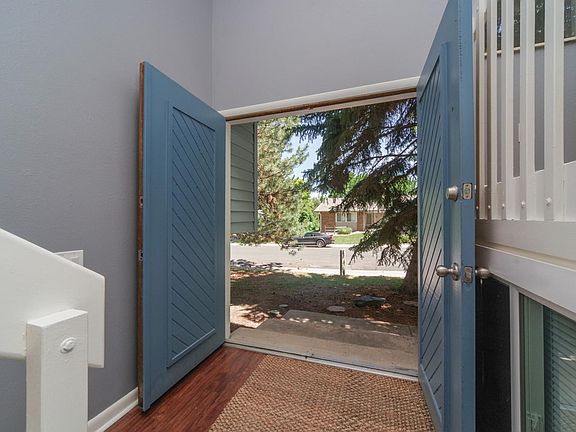 The grand double doors offer a welcoming entryway.