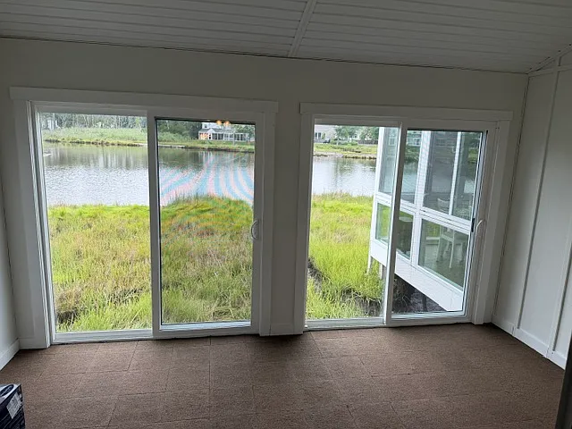 Brand new enclosed porch overlooking lake