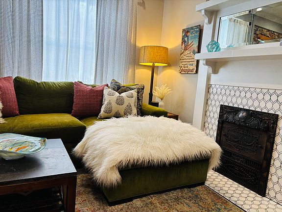 Sink into plush, comfortable seating while basking in the soft glow of carefully curated lighting that enhances the room's sophisticated vibe. The large 4K HD smart TV and Sonos speakers set the stage for immersive entertainment or a soothing ambience.