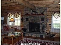 Celebrate an old fashioned Christmas in front of this fieldstone fireplace