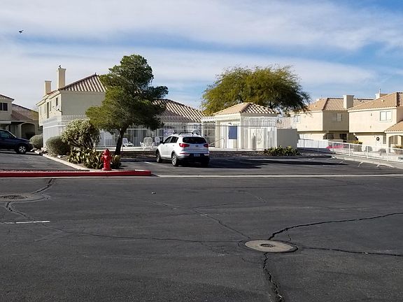 From parking space looking toward pool and mail area