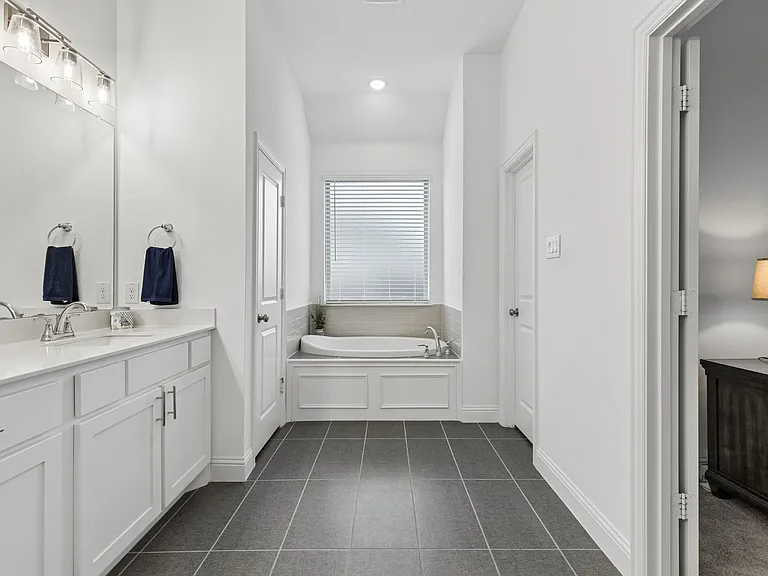 Garden tub for relaxing plus a giant walk in closet.