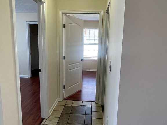 Hallway to 2 of the bedrooms and full bathroom