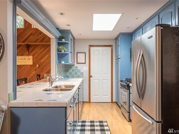 The kitchen is very open and bright.