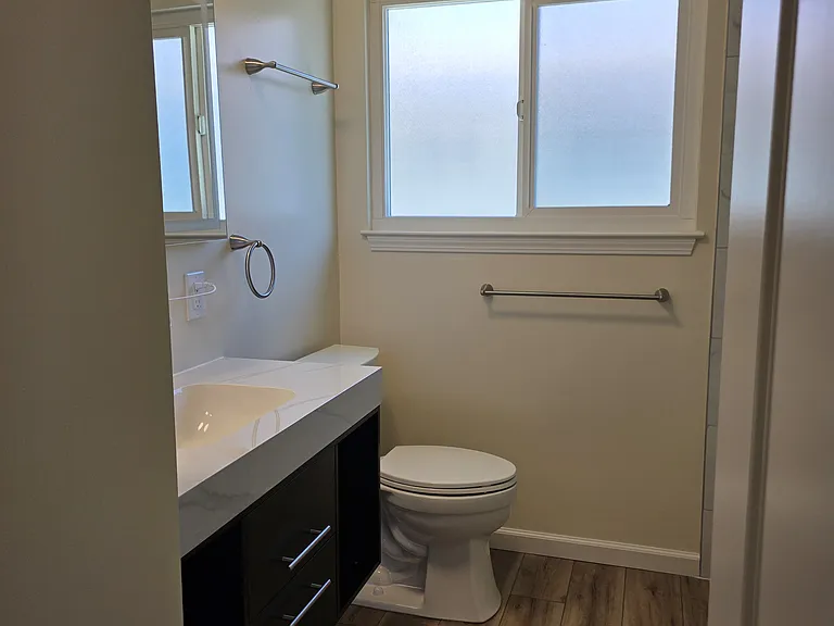 Fully remodeled bathroom with floating vanity.