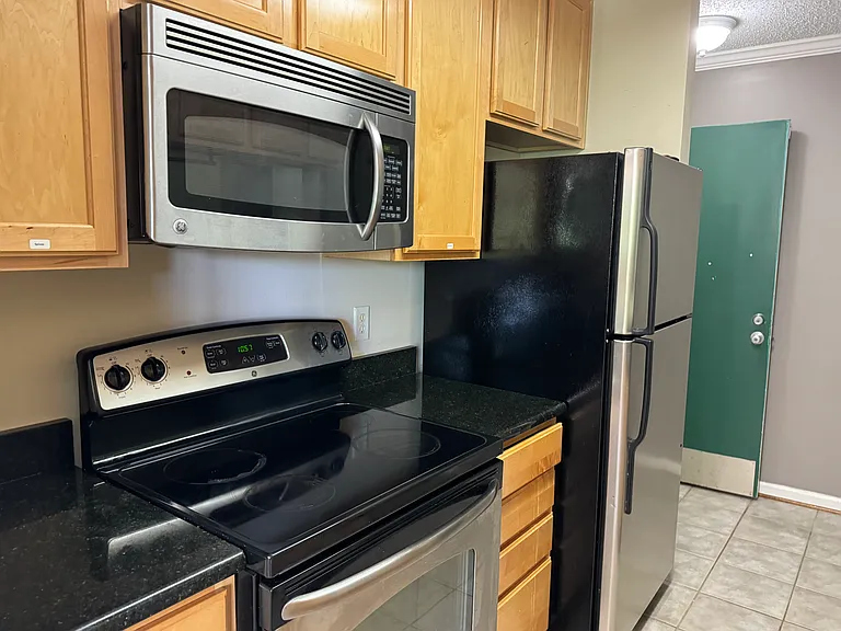 Electric Stove and Microwave. All Appliances are Clean and Ready to Use.