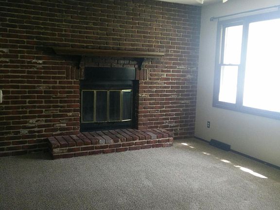 Living room with decorative fireplace
