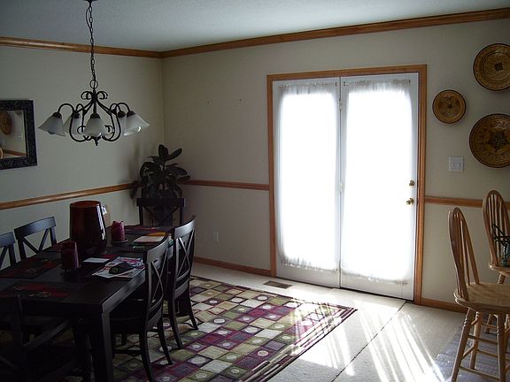 Dining to back deck, just off Kitchen