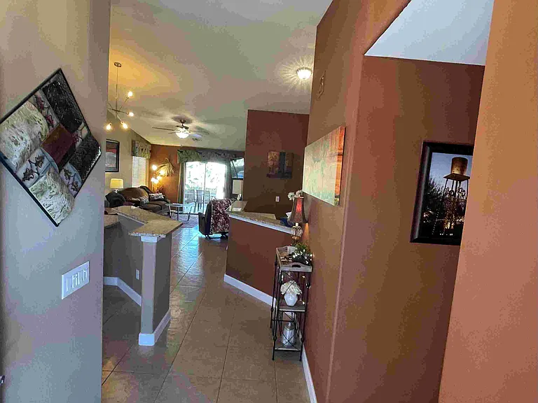 Open concept, tall ceilings, modern, awesome granite breakfast bar and island/work station!