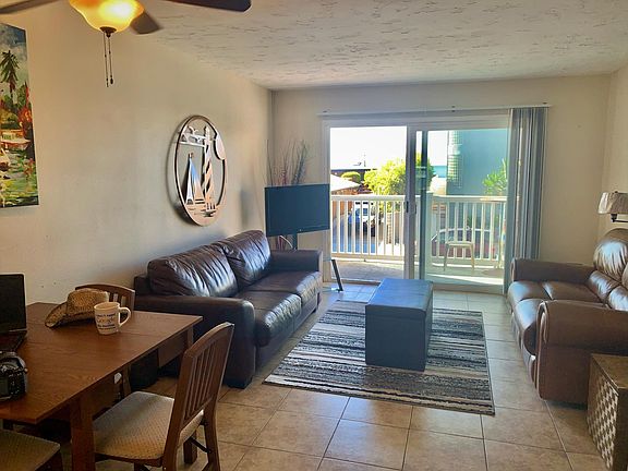 FULLY FURNISHED
comfy living rm and balcony with a nice view of the surf break.