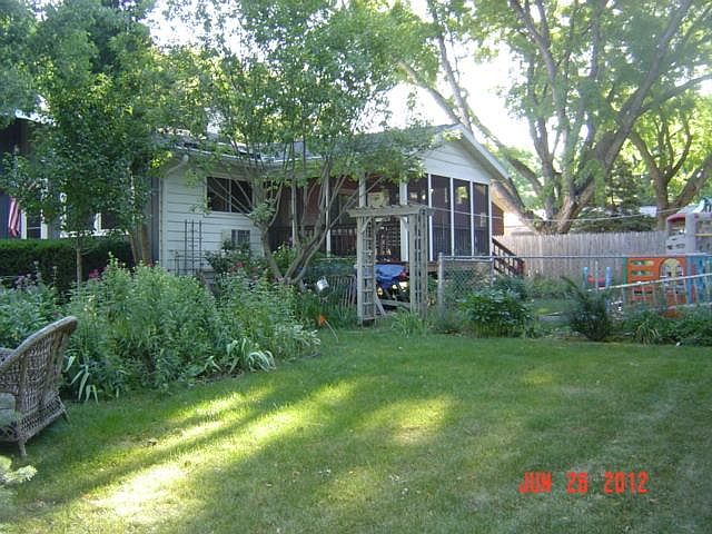 More trees now. Lots of flowers, red bud trees, privacy bushes. Grilling deck -top of stairs. YES, know pics are old but show what i want You to see!