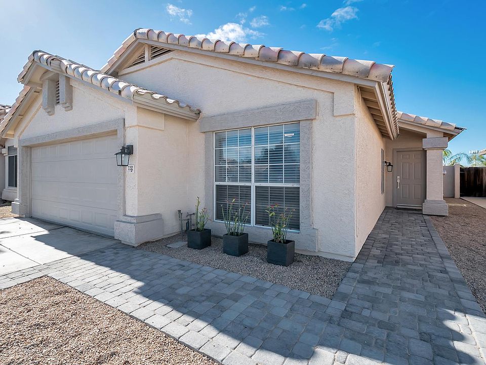 New brick paver pathway to front door and down both sides of driveway.