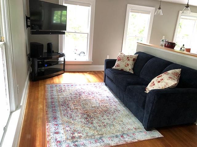 living area with pull-out queen air mattress for guests