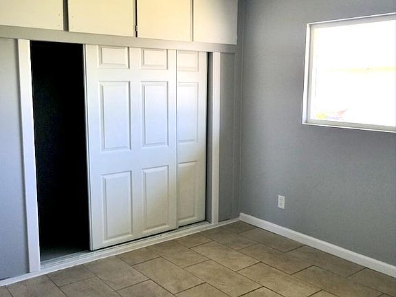 Bedroom #1 (Spacious closet with 4 cabinets above.)